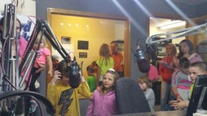 Recording studio filled with adults and children