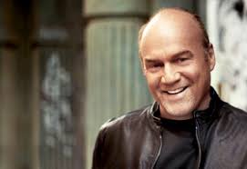 Greg Laurie wearing a brown jacket, smiling | Thy Word Network