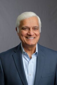 Ravi Zacharias with white hair, smiling