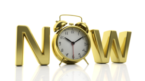 The wordings Now with a clock as the O in between