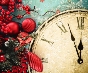 Red colored decorations near a vintage clock